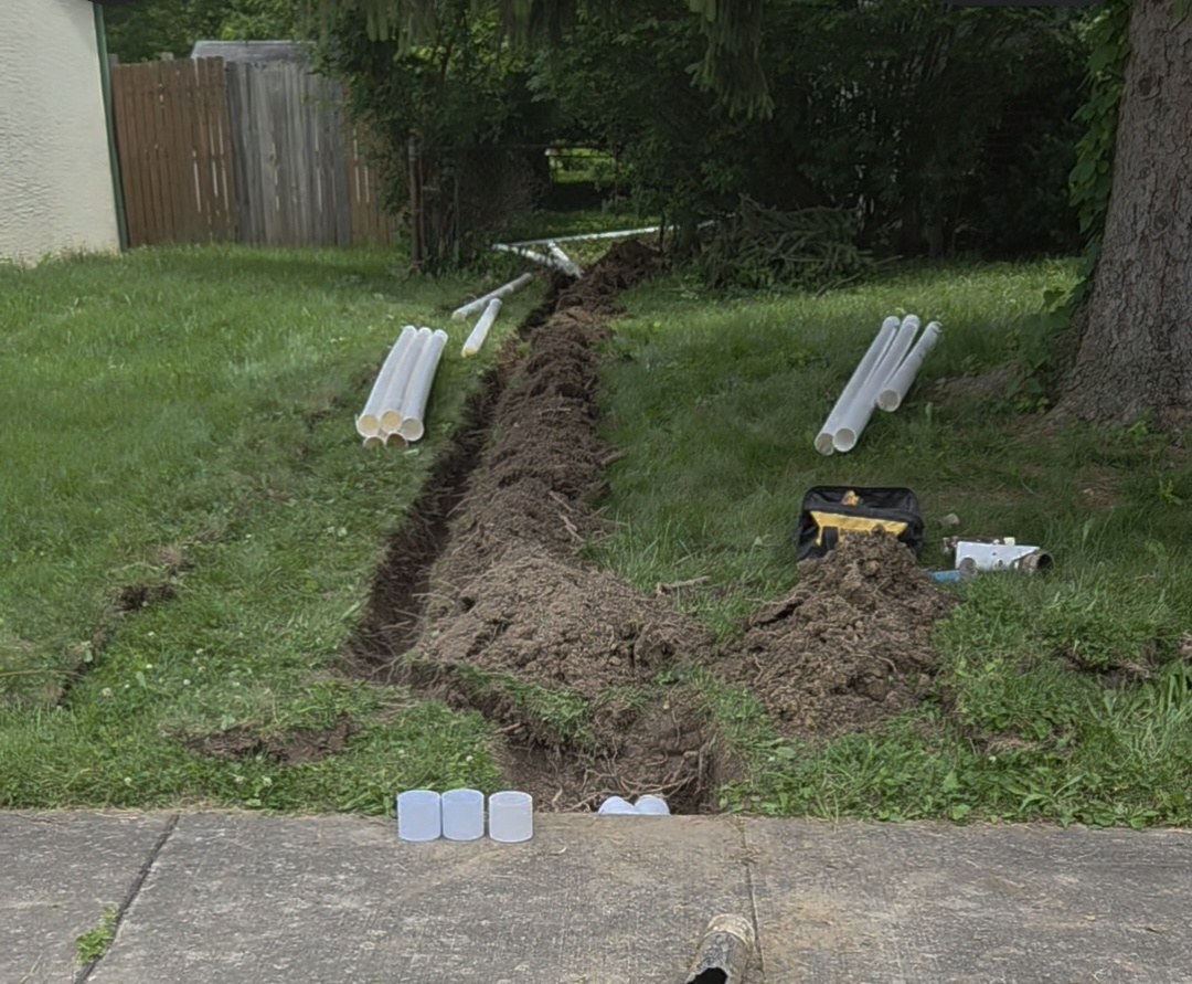 Exterior French drain tie-in installation